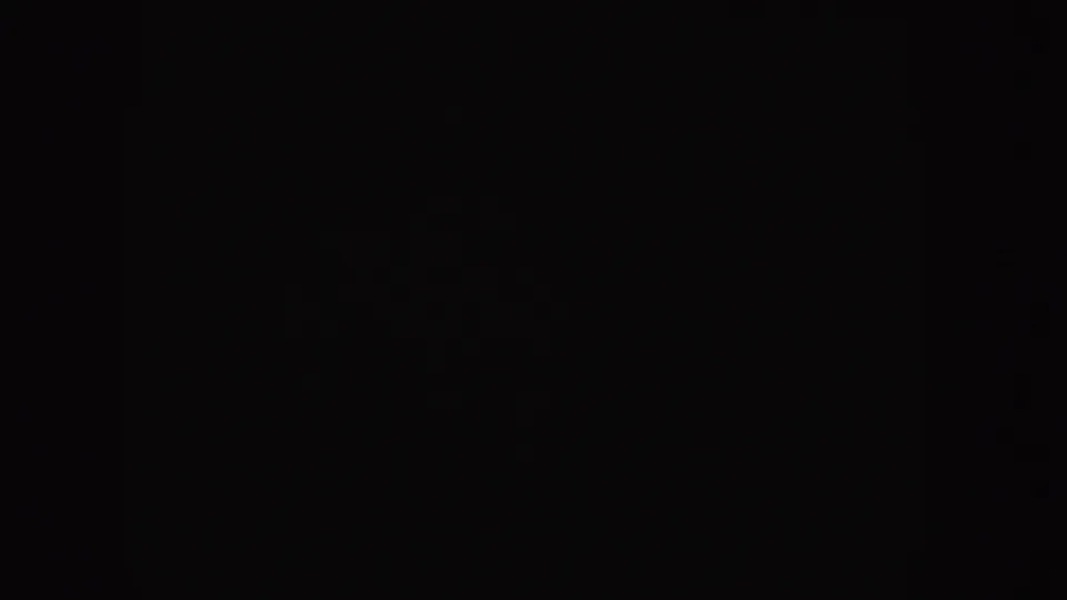 Dark blank 8mm home-movie frame from the Idaho reel, showing faint grain and no identifiable subjects.