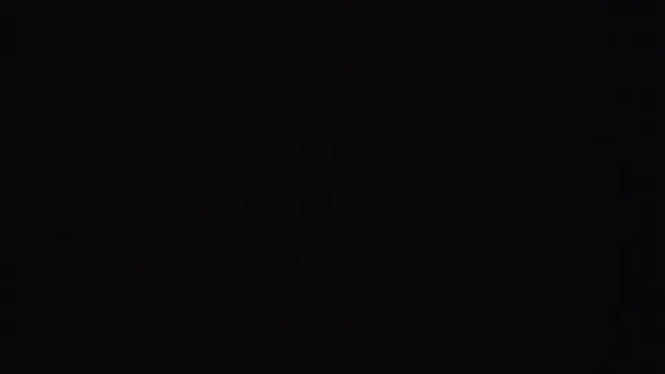 Nearly black 8mm start-screen frame from the 1955 Idaho reel, with faint grain and no visible scene content.