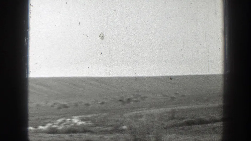 A brief wide Montana landscape view shows rolling grassland and pale sky, likely between shots of the horseback couple.