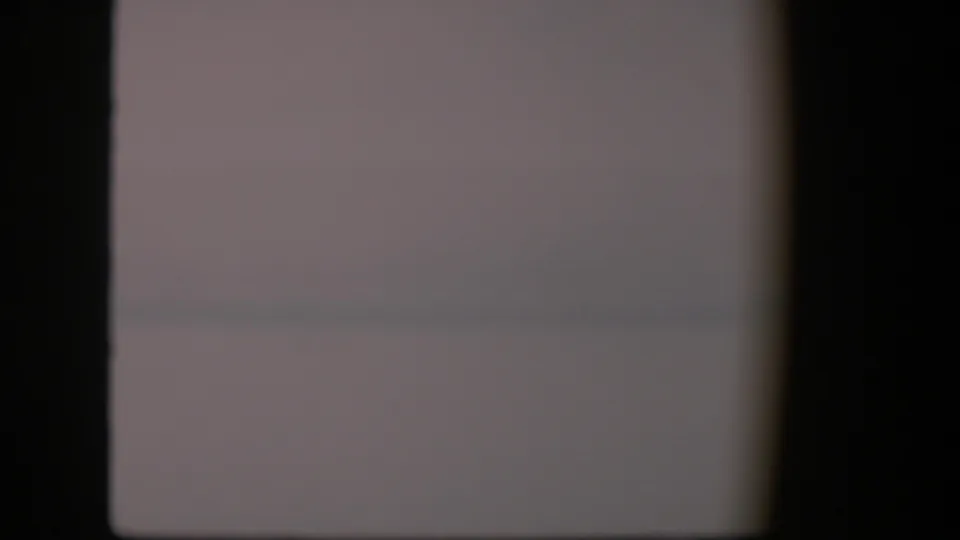 1951 Utah 8mm frame with a washed-out horizon or waterline obscured by dark gate edges and soft exposure.