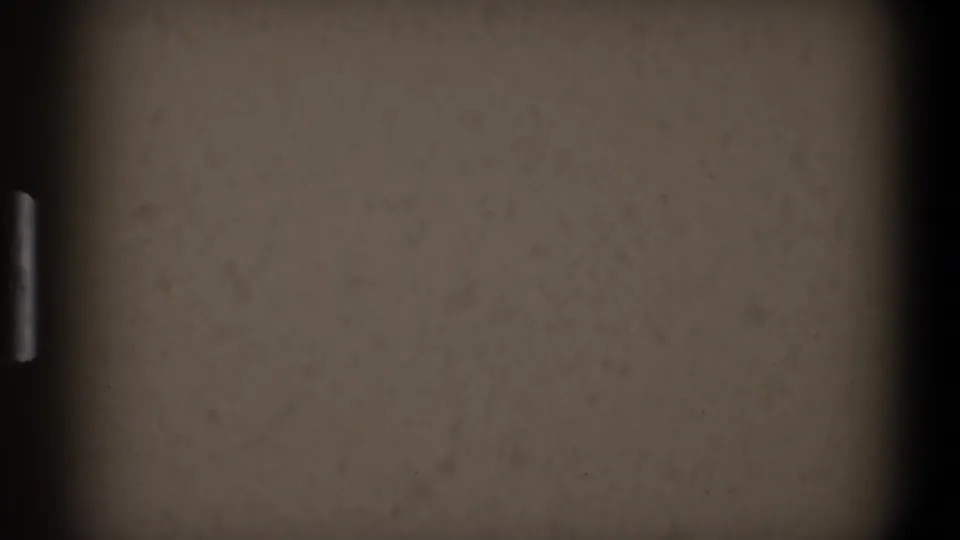 Overexposed 8mm frame from 1968 Toledo home-movie footage, with dark gate edges and visible film grain.