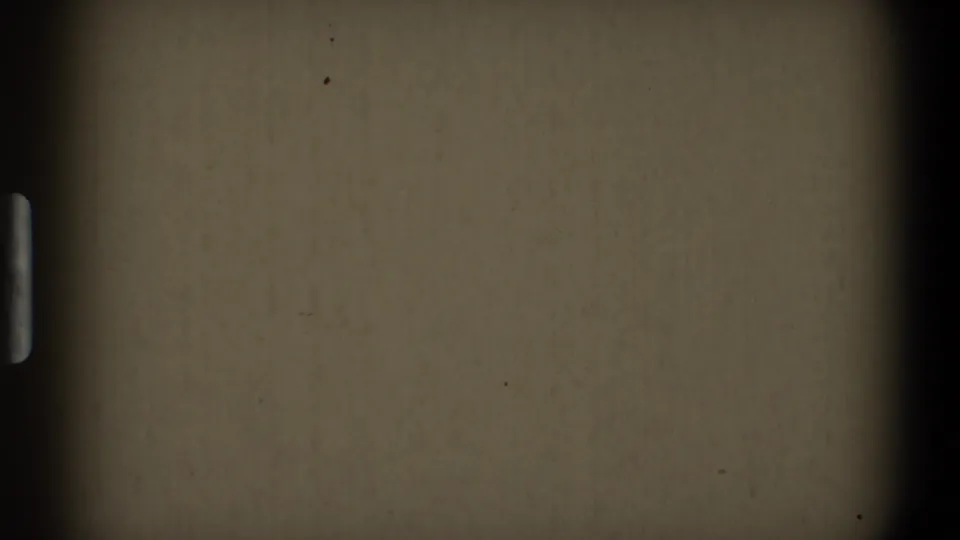 Blank 1968 8mm home-movie start frame from Toledo metadata, showing dark frame borders, muted film surface, grain, dust, and sprocket-edge traces.