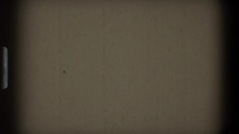 Blank 1968 8mm home-movie start frame showing a horizontal frame division, dark side borders, muted surface, dust, grain, and edge falloff.