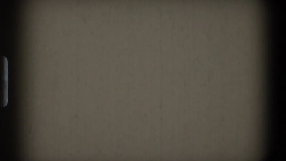 Blank start-screen frame from the 1968 Toledo 8mm clip, showing muted film stock, a horizontal frame line, dark side border, dust, grain, and soft vignetting.