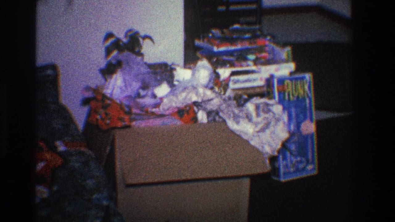 Open cardboard box filled with crumpled wrapping paper and gift packaging.