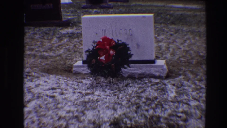 Closer 1968 Toledo cemetery view of the Willard gravestone, wreath, red bow, and surrounding grass.