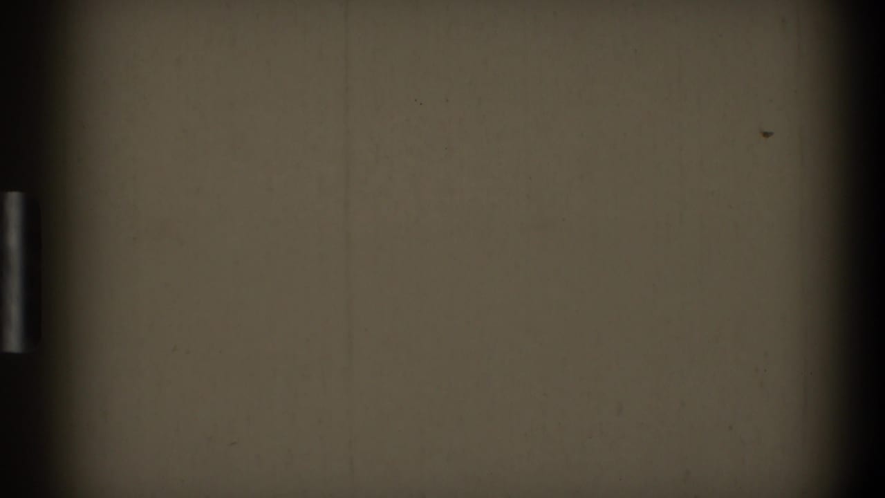 Blank off-white 8mm frame with dark vertical edge, dust, and faint scratches.