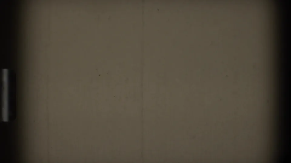 1968 Toledo 8mm frame with a blank off-white field, dark vertical banding, dust spots, and faint surface scratches.
