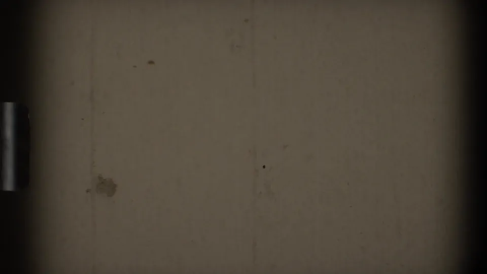 1968 Toledo 8mm home-movie frame showing an unexposed-looking surface, dark edge shadow, dust, scratches, and grain.
