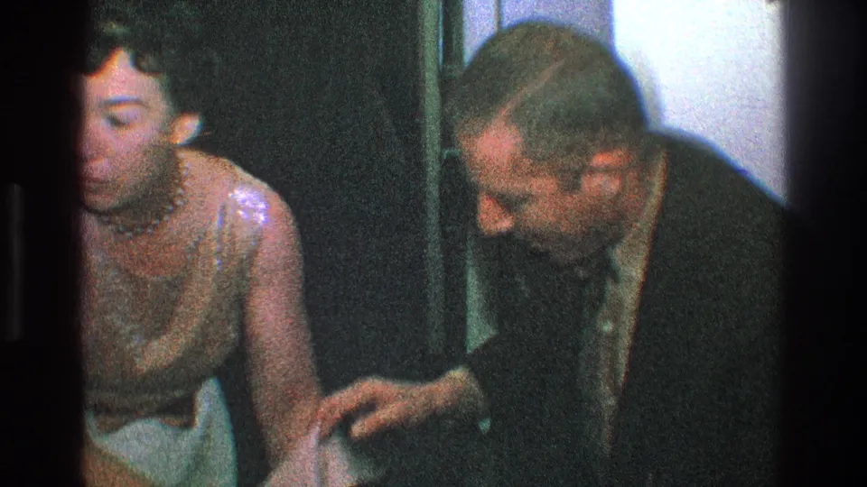 In the final frame, the woman and suited man lean close with hands near each other, suggesting continued laughter or clapping in the private interior.