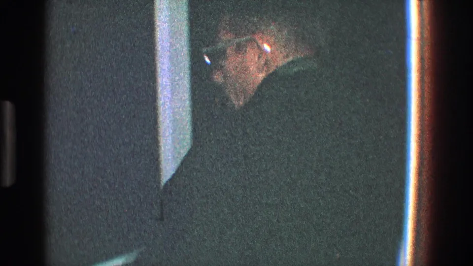 In the final 1968 Toledo frame, the man in a dark hat and glasses is seen near a doorway or wall edge, partly obscured by shadow.