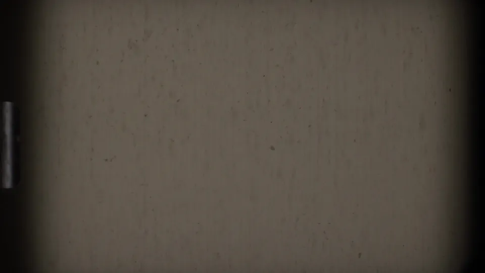 Near-blank closing frame from the 8mm clip, with beige exposure, dark film border, and visible dust marks.