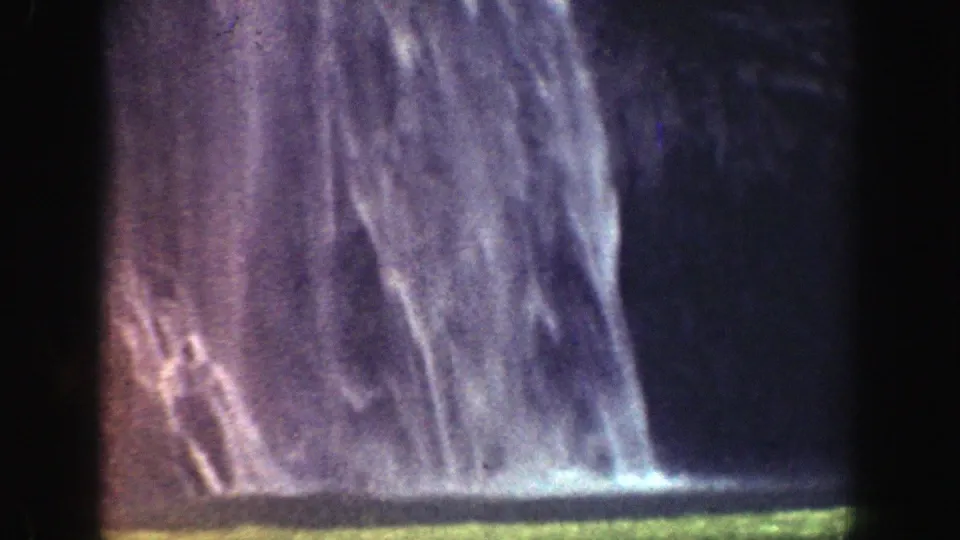 Water cascades down into a green pool in the final 1937 California 8mm frame, with pronounced grain and color shift.