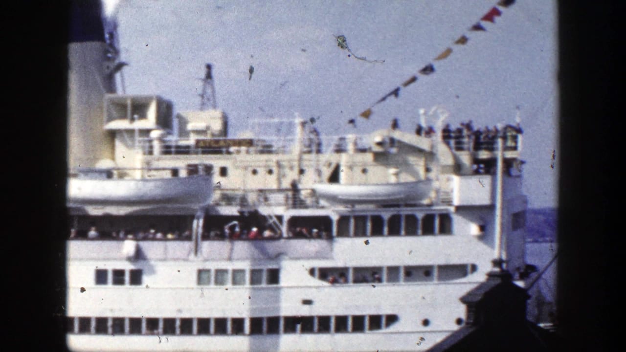White passenger ship seen through a dark window frame with signal flags overhead.