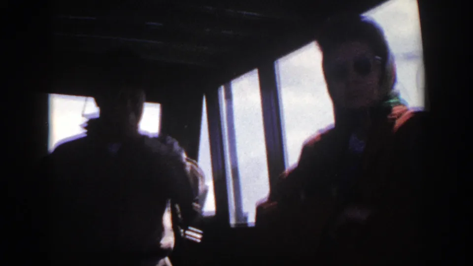 The final frame shows the bus interior in deep shadow, with the woman by the window and another passenger silhouetted nearby.