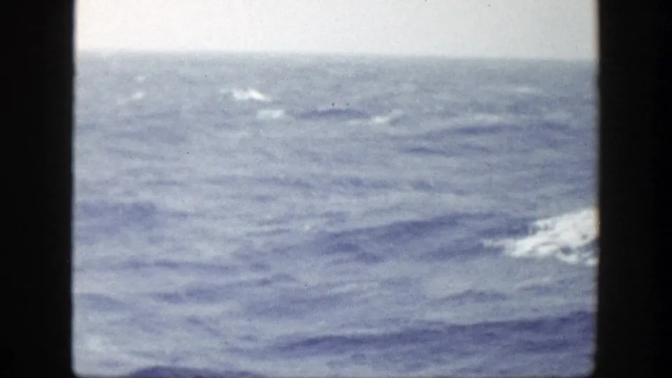 Open ocean and small wave crests fill the frame, continuing the coastal New York sailing sequence.