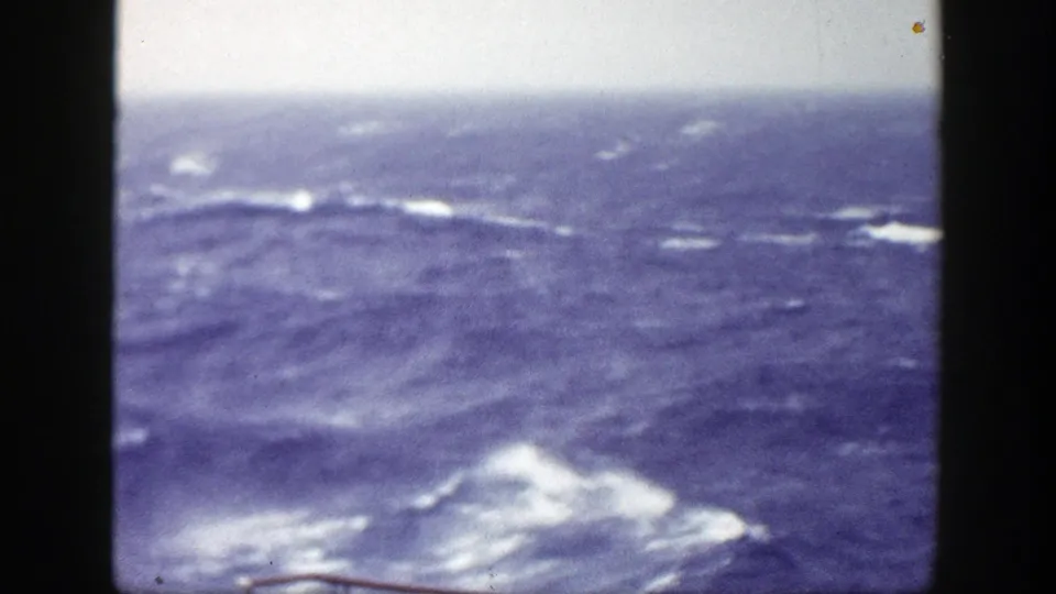 1948 8mm view near New York focused on rolling ocean swells and whitecaps, framed by dark film edges.