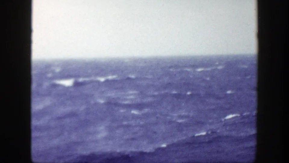 Deck-level 8mm view of choppy ocean and scattered whitecaps during a 1948 New York-area sea voyage.