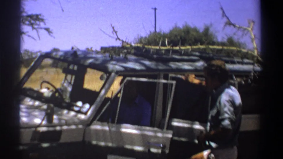 The final frame shows the man near the vehicle door and roof rack during a Kenya safari stop in 1969.