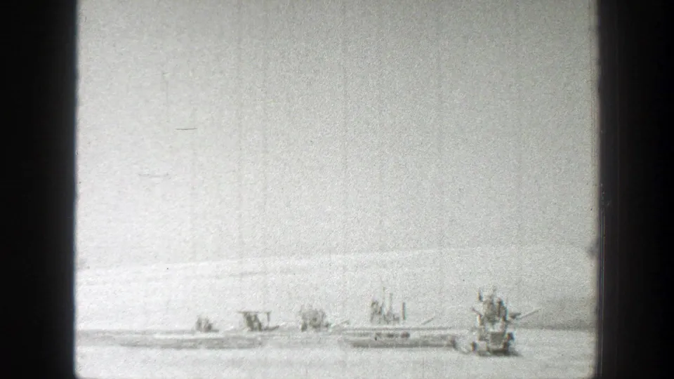 Wide 1939 California field view with harvest machinery and a tractor-like vehicle seen at a distance.