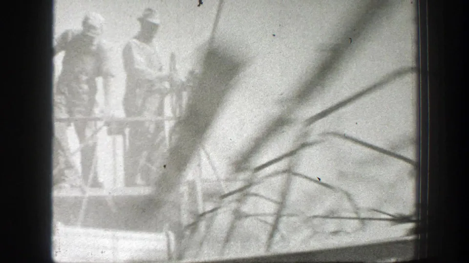 1939 California farm footage showing workers near large agricultural equipment, with soft focus and visible 8mm film borders.