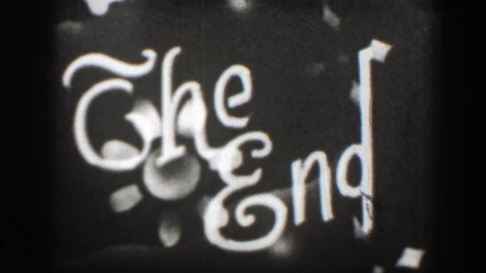 Soft 8mm frame of a hand-lettered The End card, marking the close of the home-movie sequence.