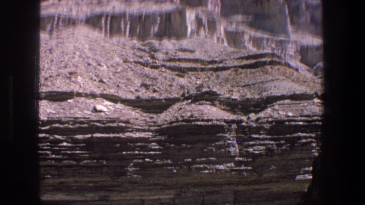 Layered desert rock formation seen in soft 8mm close view.