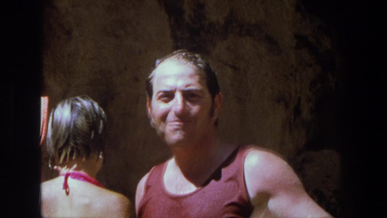In the Utah 1969 clip, a wet man in a red tank top smiles toward the camera while a woman in a pink bikini stands beside him in shadow.