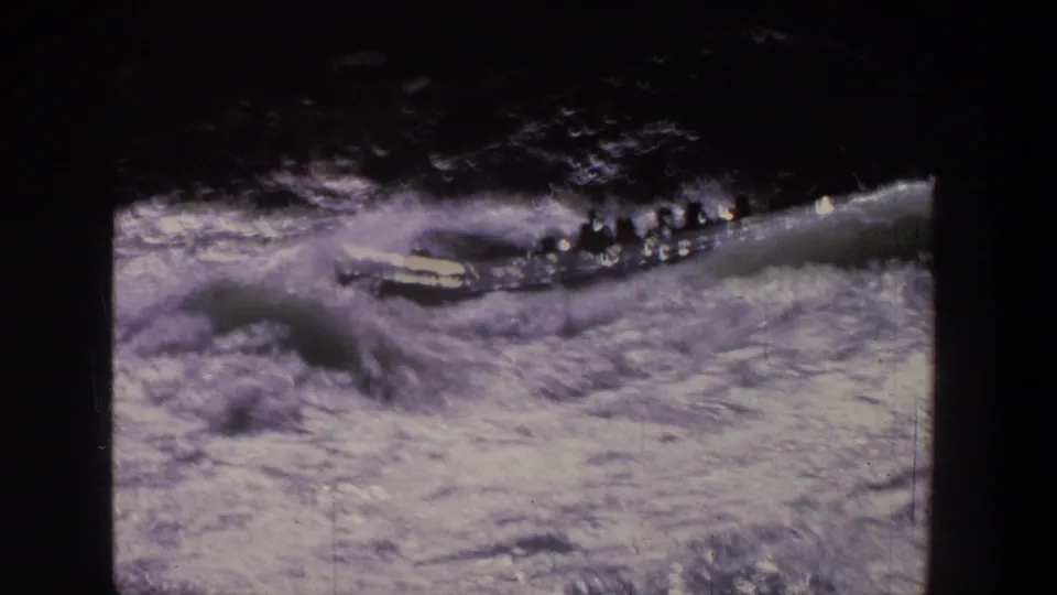 The raft appears farther downstream, carrying passengers across turbulent rapids in the 1969 Utah footage.