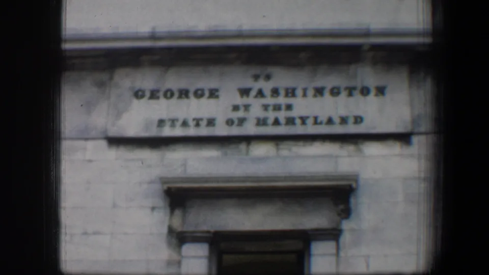 The dedication plaque is most legible here, reading to George Washington by the State of Maryland above a doorway.