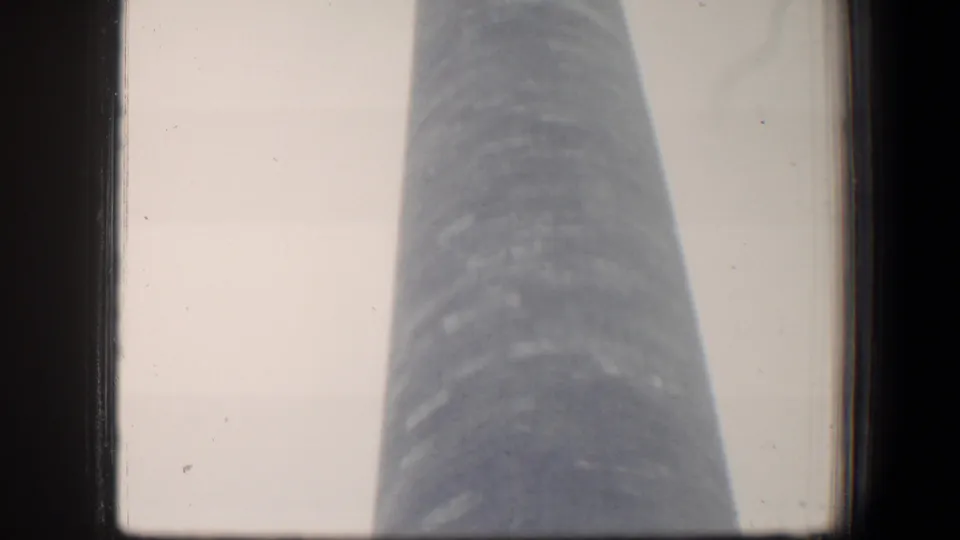The George Washington Monument obelisk remains centered in a soft 8mm Baltimore frame, emphasizing height and vertical scale.