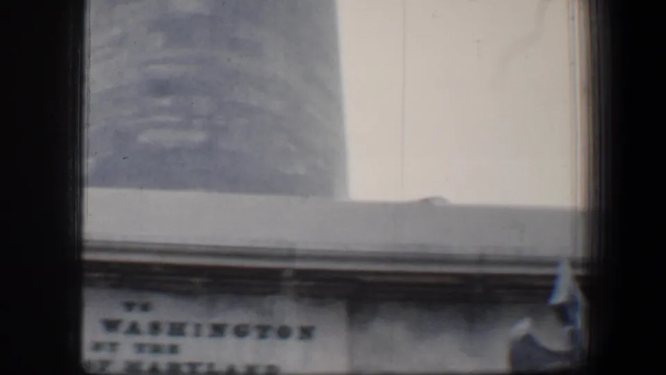 1960 Baltimore frame with the monument shaft and a partially readable inscription at the George Washington Monument base.