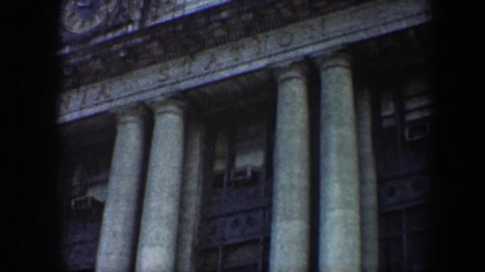 1960 Baltimore station columns and window bays, with weathered stone detail and a soft 8mm home-movie look.