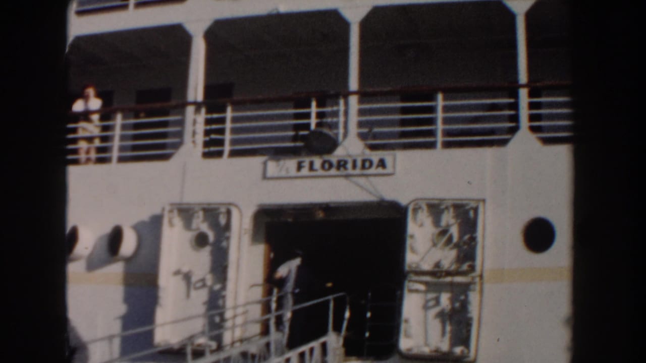 Cruise ship entrance with the name Florida above a gangway and people on deck.
