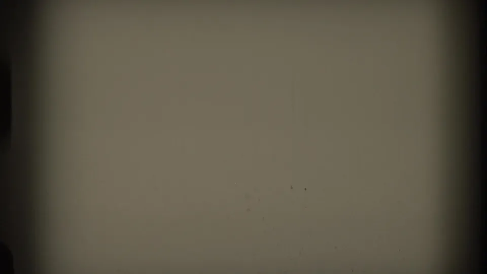 The final frame is largely blank or overexposed film leader-like material with dark gate edges and faint marks.