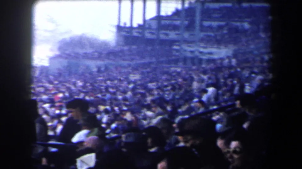 A wider 1958 California racetrack view shows a large spectator crowd under grandstand structures, softened by exposure and film grain.
