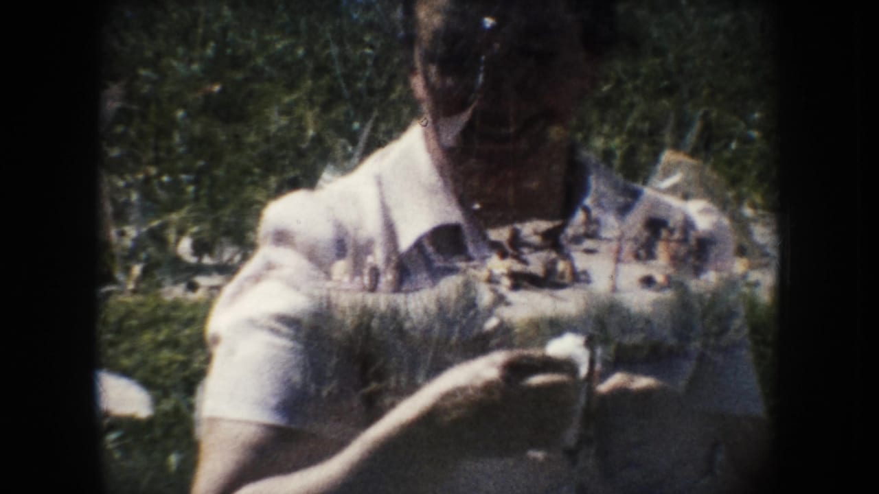 Woman in glasses and a light dress holds a small white object outdoors, with 8mm grain, foliage, and exposure overlap visible.
