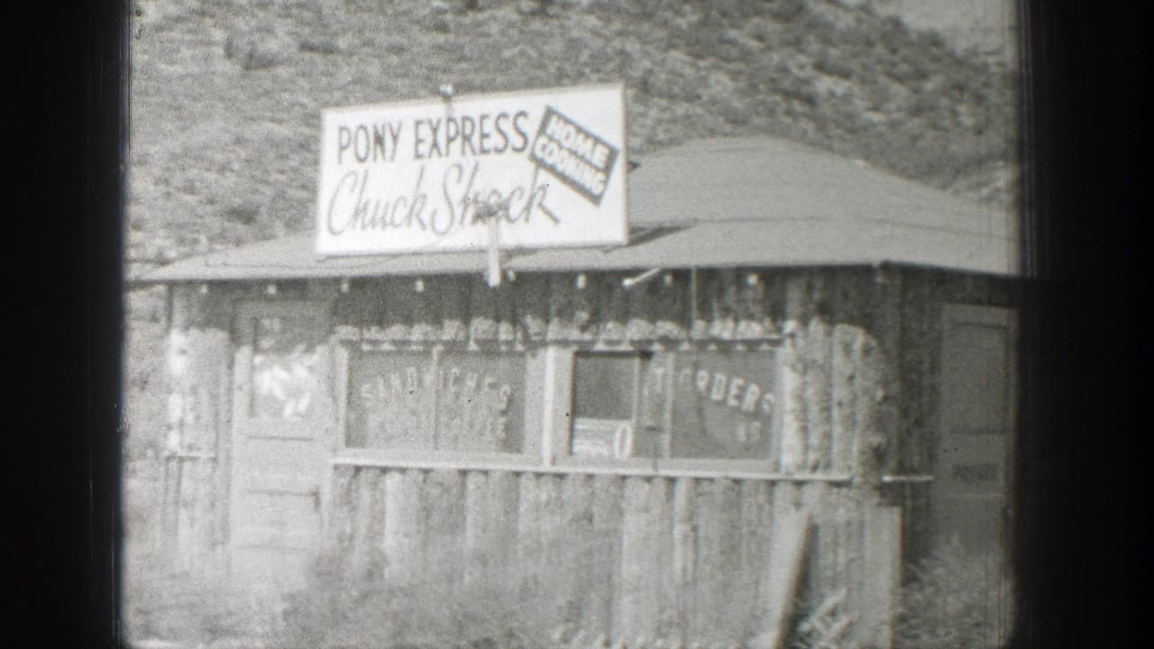 Weathered roadside stand with Pony Express Chuck Shock and Home Cooking signs.