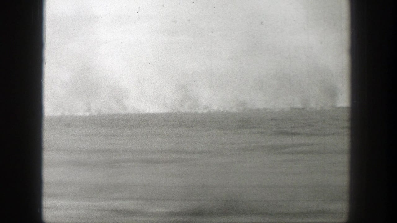Distant horizon with pale clouds or dust seen past a dark central divider.