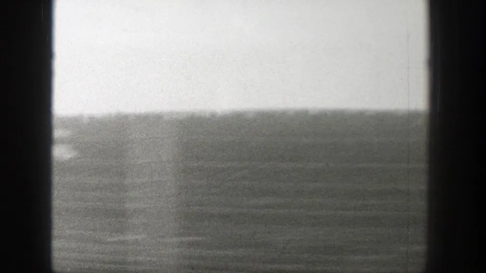 Moving 1939 Wyoming travel view with open ground, low horizon, and smeared roadside detail.