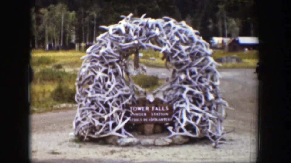 1939 Wyoming home-movie view of the antler arch centered over the Tower Falls Ranger Station sign.