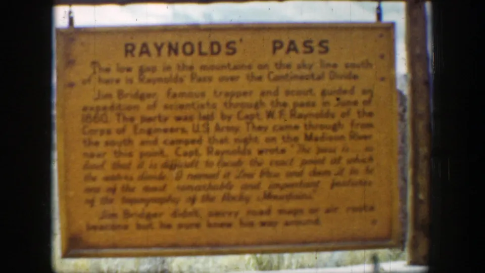 The Reynolds' Pass marker fills the frame, with soft focus, warm color, and 8mm frame edges visible.