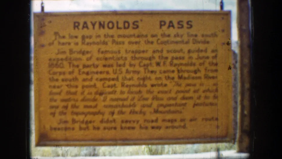 Final 1939 Wyoming frame holds on the yellow Reynolds' Pass marker, with visible 8mm grain, weave, and dark edge framing.