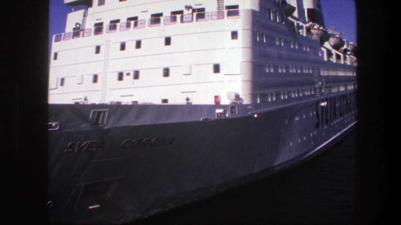 1975 Sweden 8mm frame showing the Svea Corona passenger ship docked in port, with white decks and hull lettering visible.