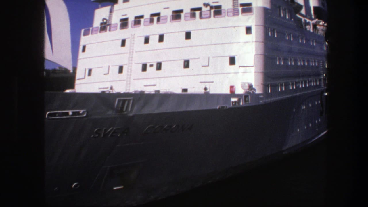 Close view of the Svea Corona ship’s bow and white superstructure at the dock.