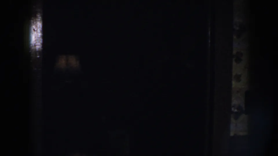 The final frame is largely shadowed, showing a dim private interior with slight wall texture and a patterned edge.