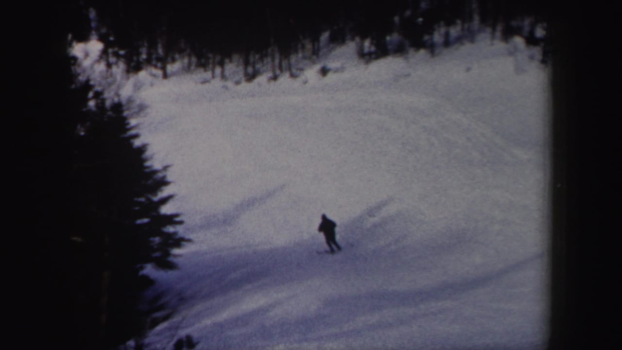 Near the end of the clip, the skier appears small against the snowy New York hillside and dark tree border.