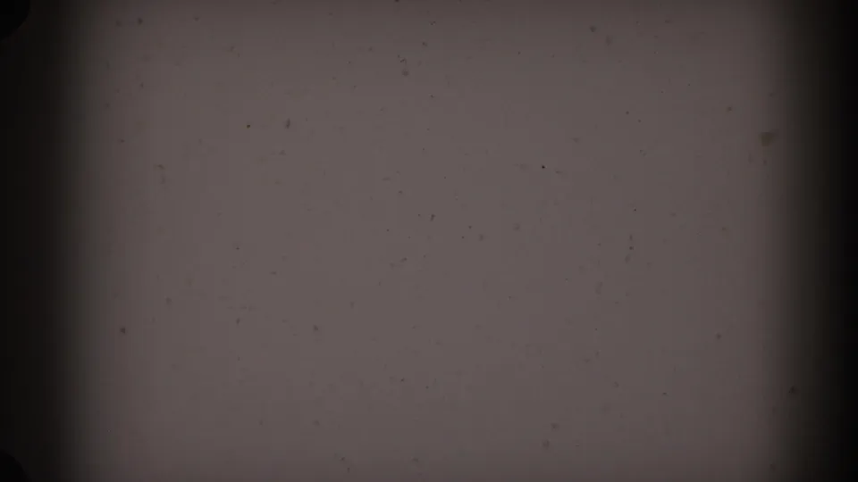 1962 Glendale 8mm frame with dark gray film texture, vertical black bands, scattered dust, grain, and a faint edge mark.