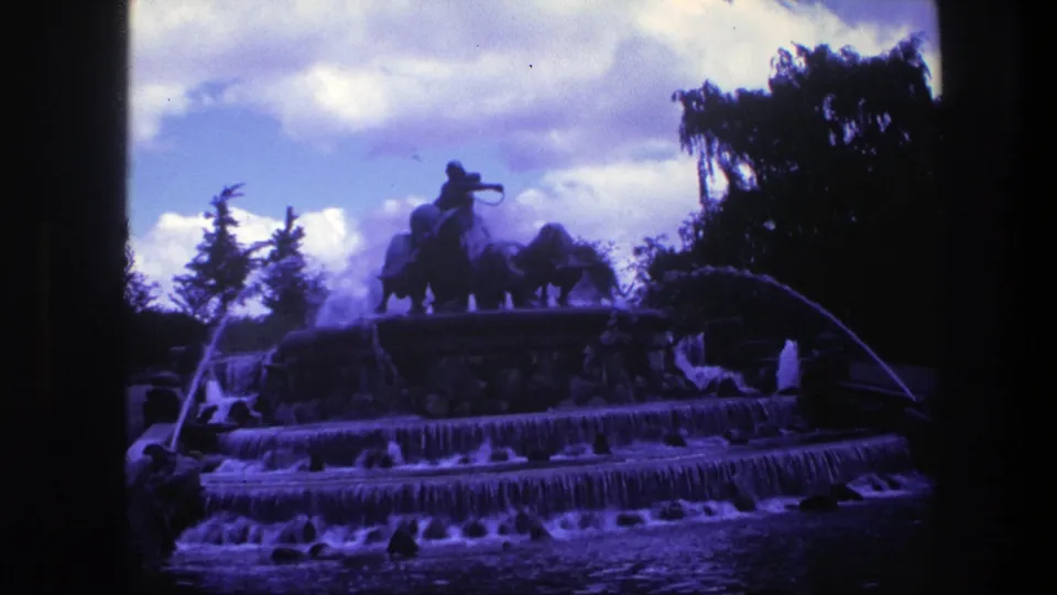 A final Copenhagen fountain view shows cascading tiers, a silhouetted equestrian statue, trees, sky, and heavy blue-purple 8mm color shift.