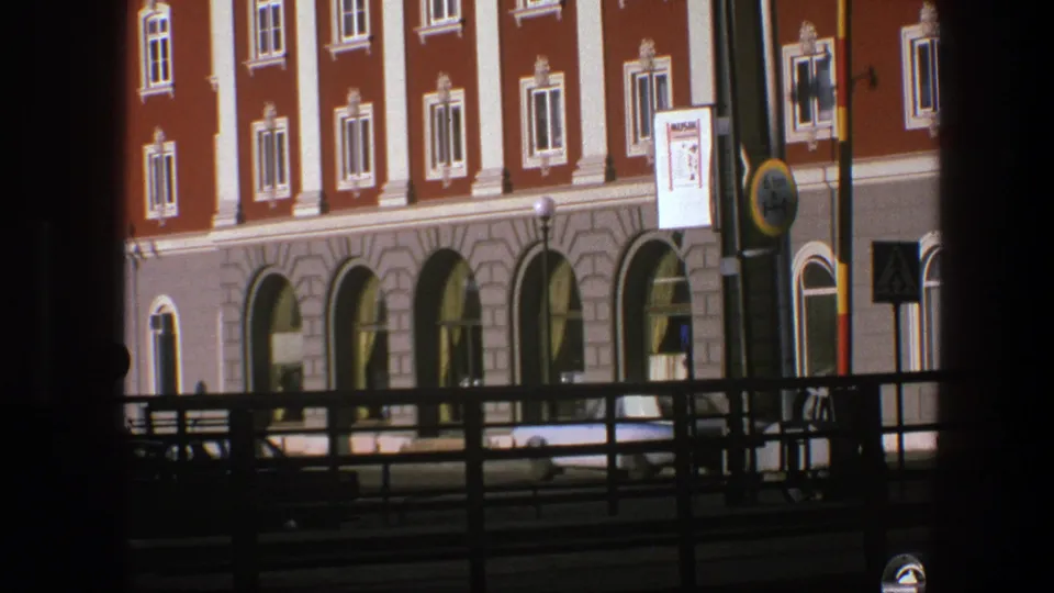 Close 1975 Copenhagen view of the Stora Hotellet lower facade, with arched windows, railings, and signage.